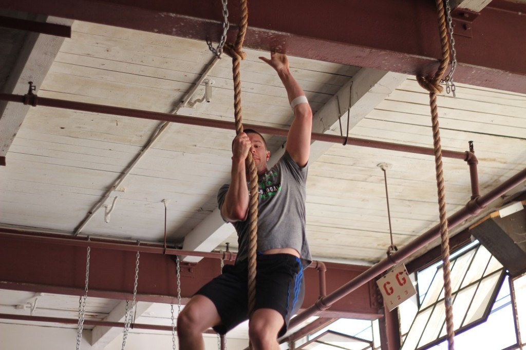 Brian W. going for the beam on a legless rope climb!