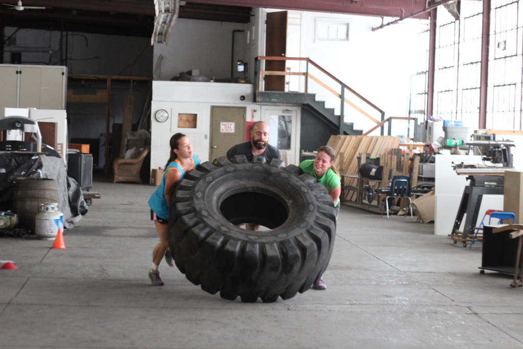 Marissa, Ceil and Patrick Z flipping the big tire!