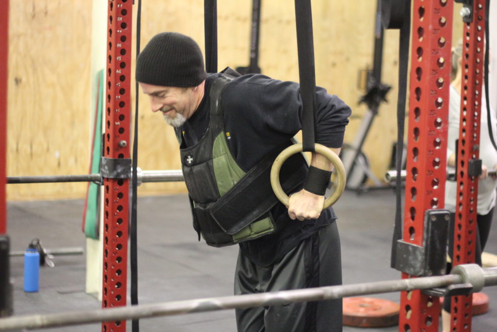 Tim hitting some weighted ring dips!